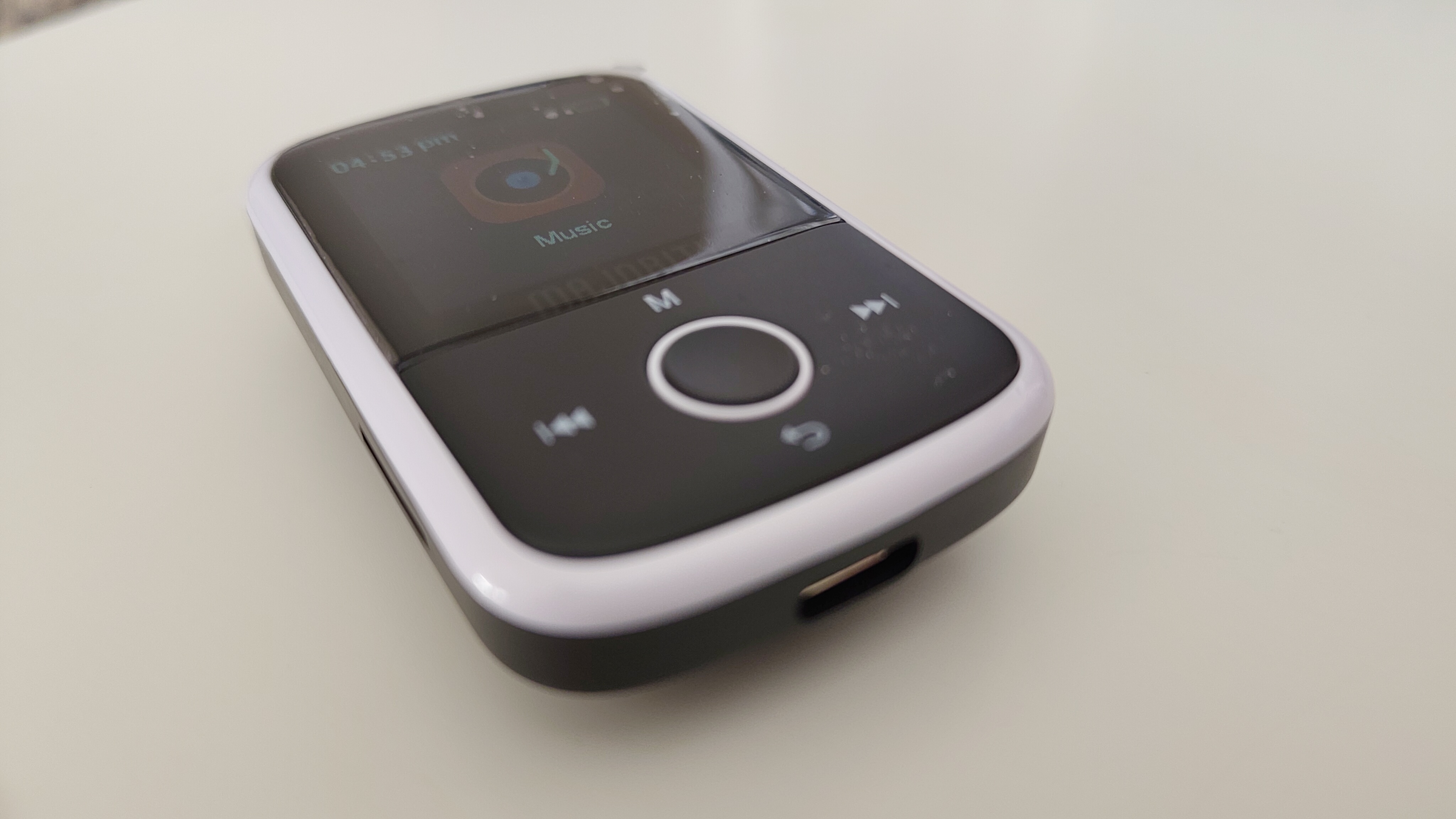 A Majority MP3 Player on a white desk in a home office