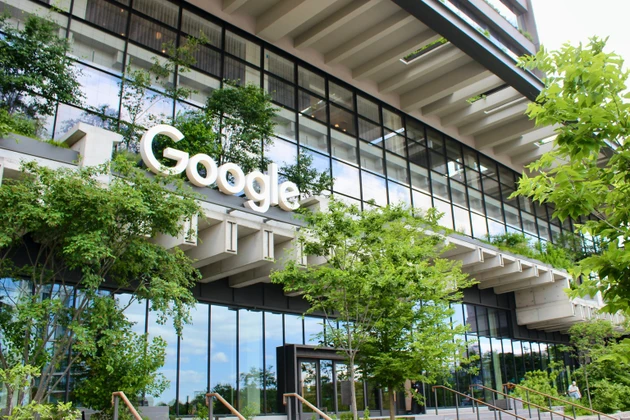 Green facade of the Google headquarters at St. John"s Terminal in Hudson Square, NYC