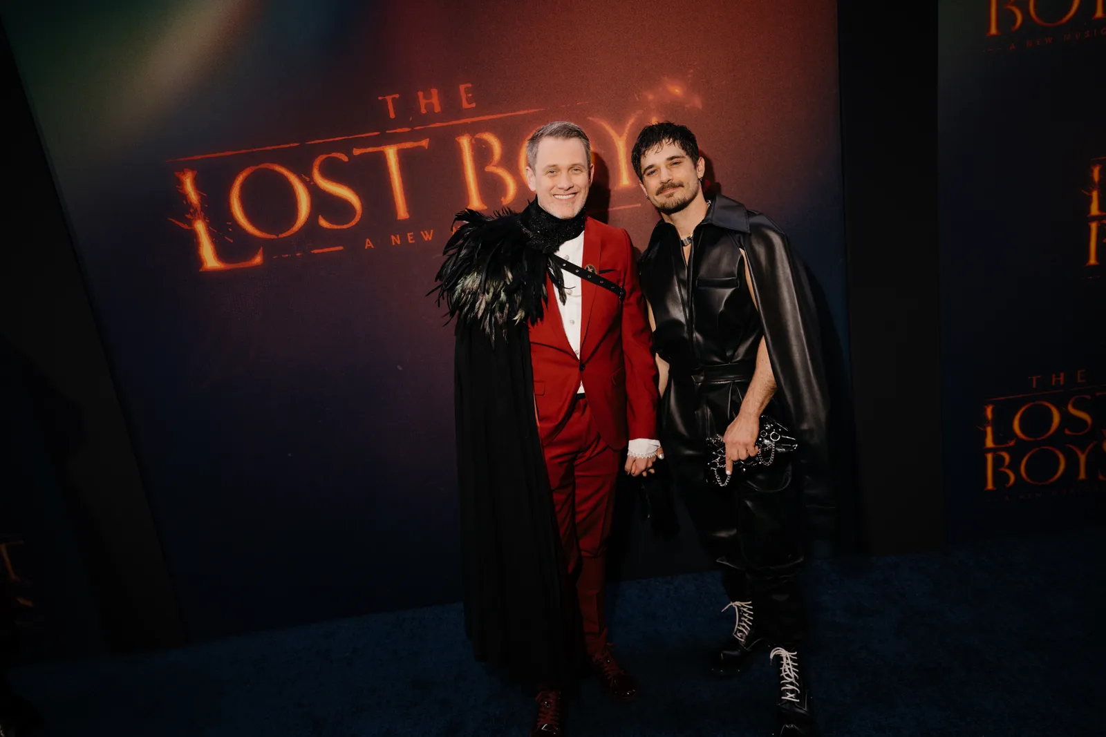 Image may contain Michael Arden Andy Mientus Clothing Coat Jacket Fashion Person Adult Face Head and People