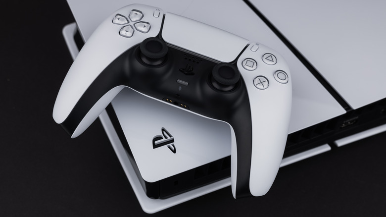 DualSense controller resting on top of a PlayStation 5 console.