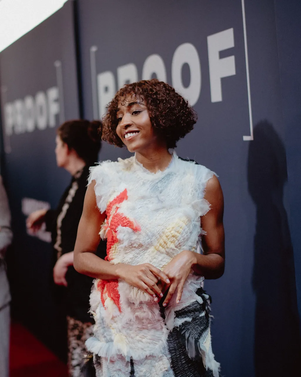 Image may contain Adult Person Wedding Curly Hair Hair Face Head and Fashion