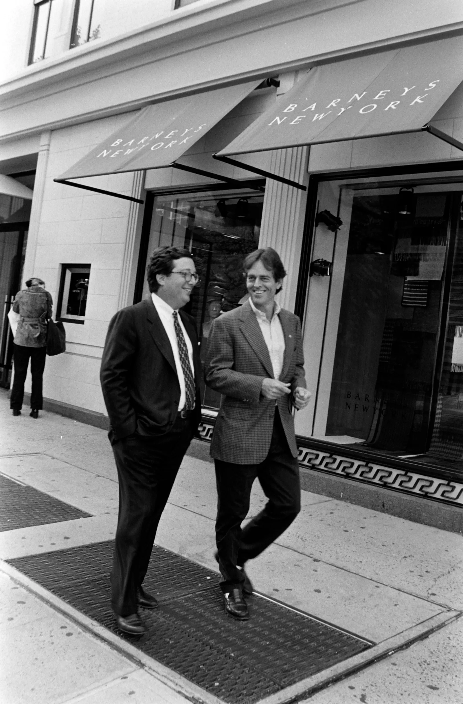 Image may contain Bobby Shriver Clothing Coat Formal Wear Suit Jacket Blazer Person Walking Adult and Accessories