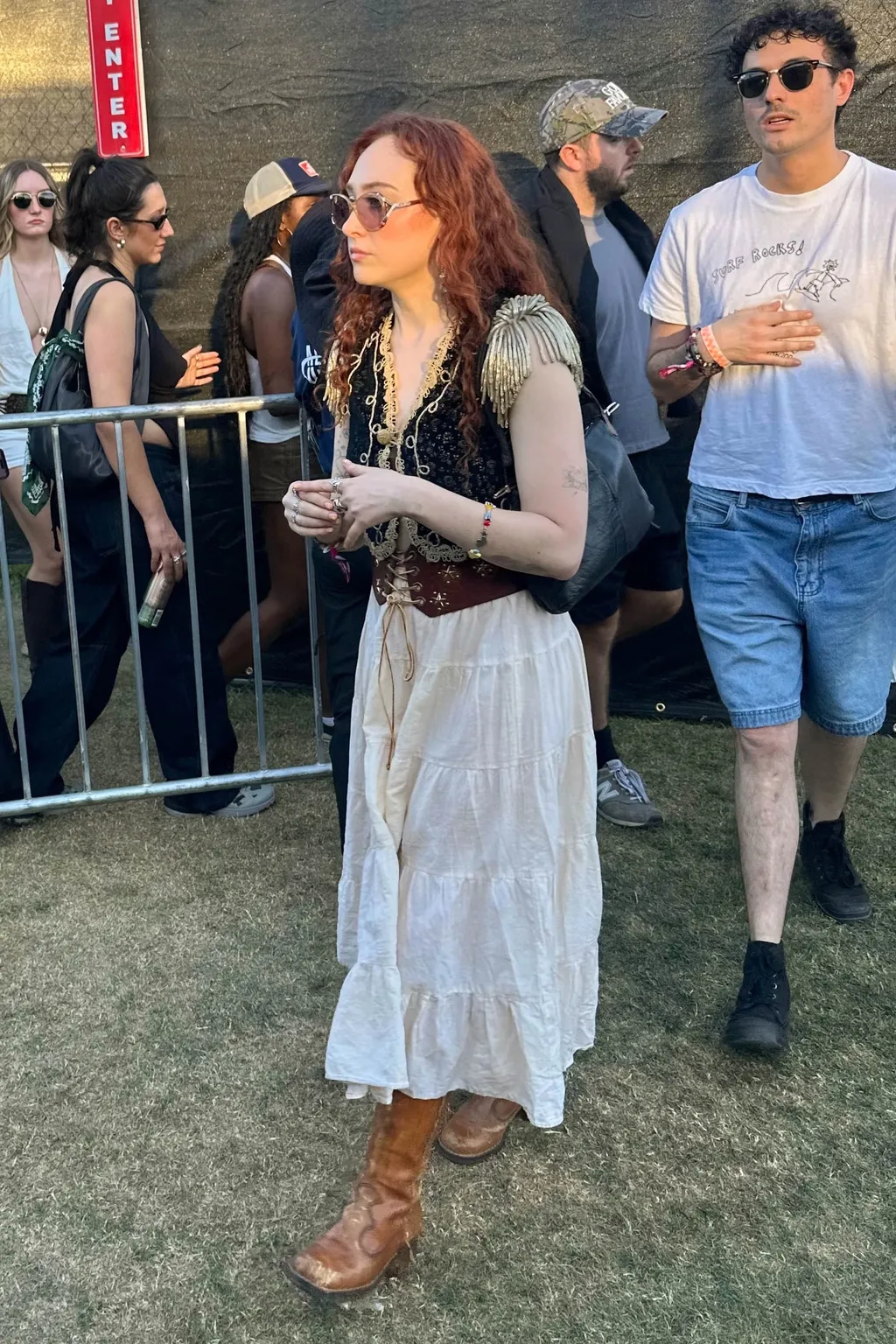 Image may contain Adult Person Accessories Glasses Clothing Hat Photobombing Jewelry Necklace Footwear and Shoe