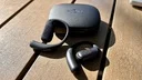 shokz openfit pro earbuds and case on table