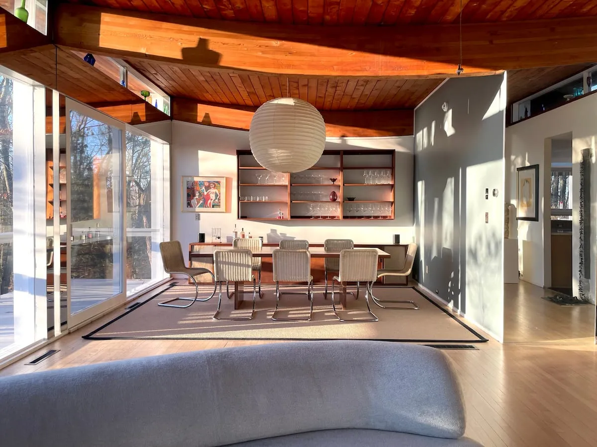 Image may contain Indoors Interior Design Architecture Building Dining Room Dining Table Furniture Room and Table