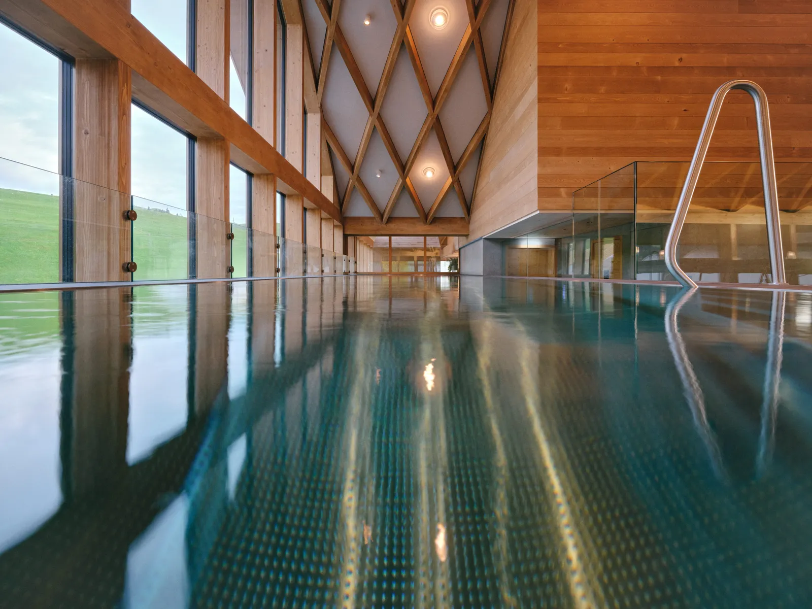Image may contain Floor Flooring Indoors Interior Design Pool Water Swimming Pool Architecture Building and Hotel