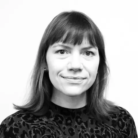 A black and white portra…k shoulder-length hair.