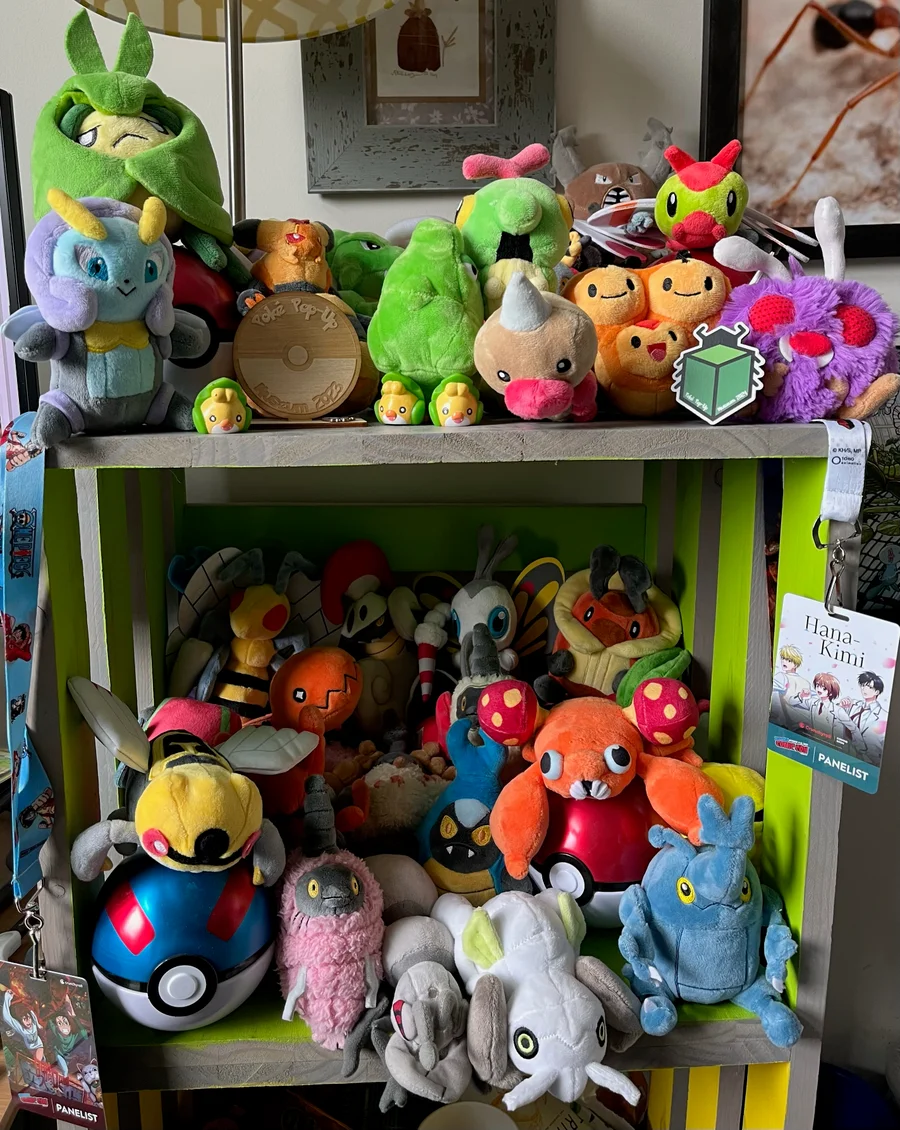 a book shelf packed with pokemon plush dolls