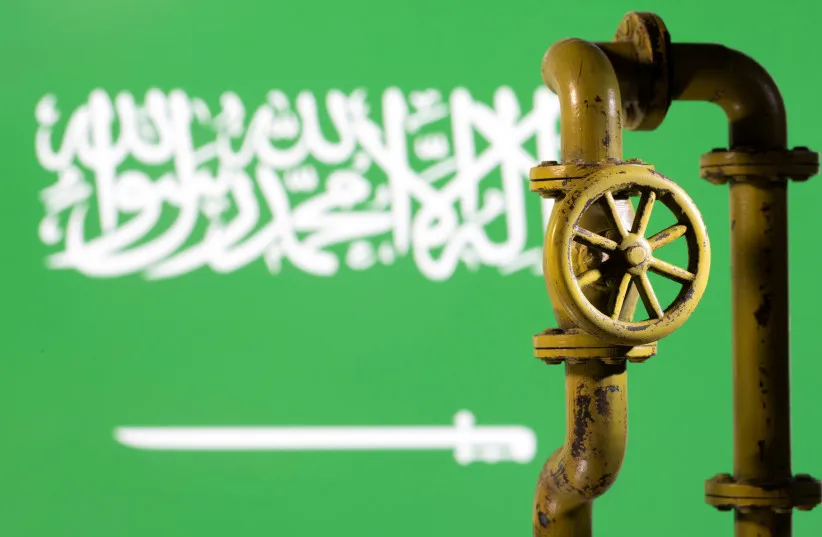 A 3D printed natural gas pipeline is placed in front of displayed Saudi Arabian flag in this illustration taken February 8, 2022.