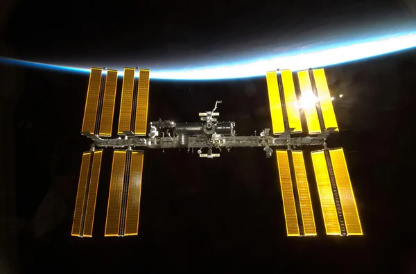 The International Space Station shown in front of Earth