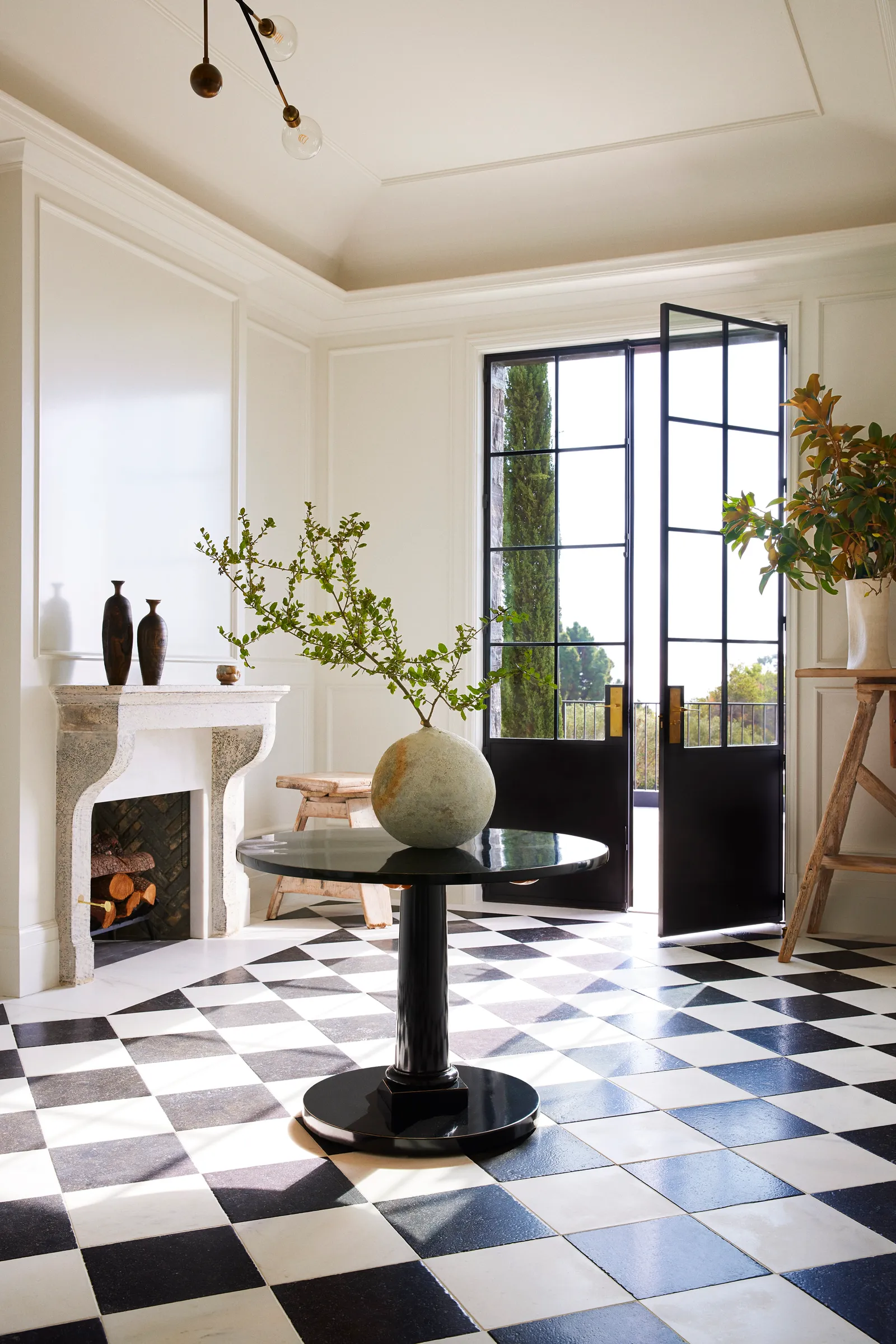 Image may contain Floor Flooring Desk Furniture Table Lamp Fireplace Indoors Plant Door and Home Decor