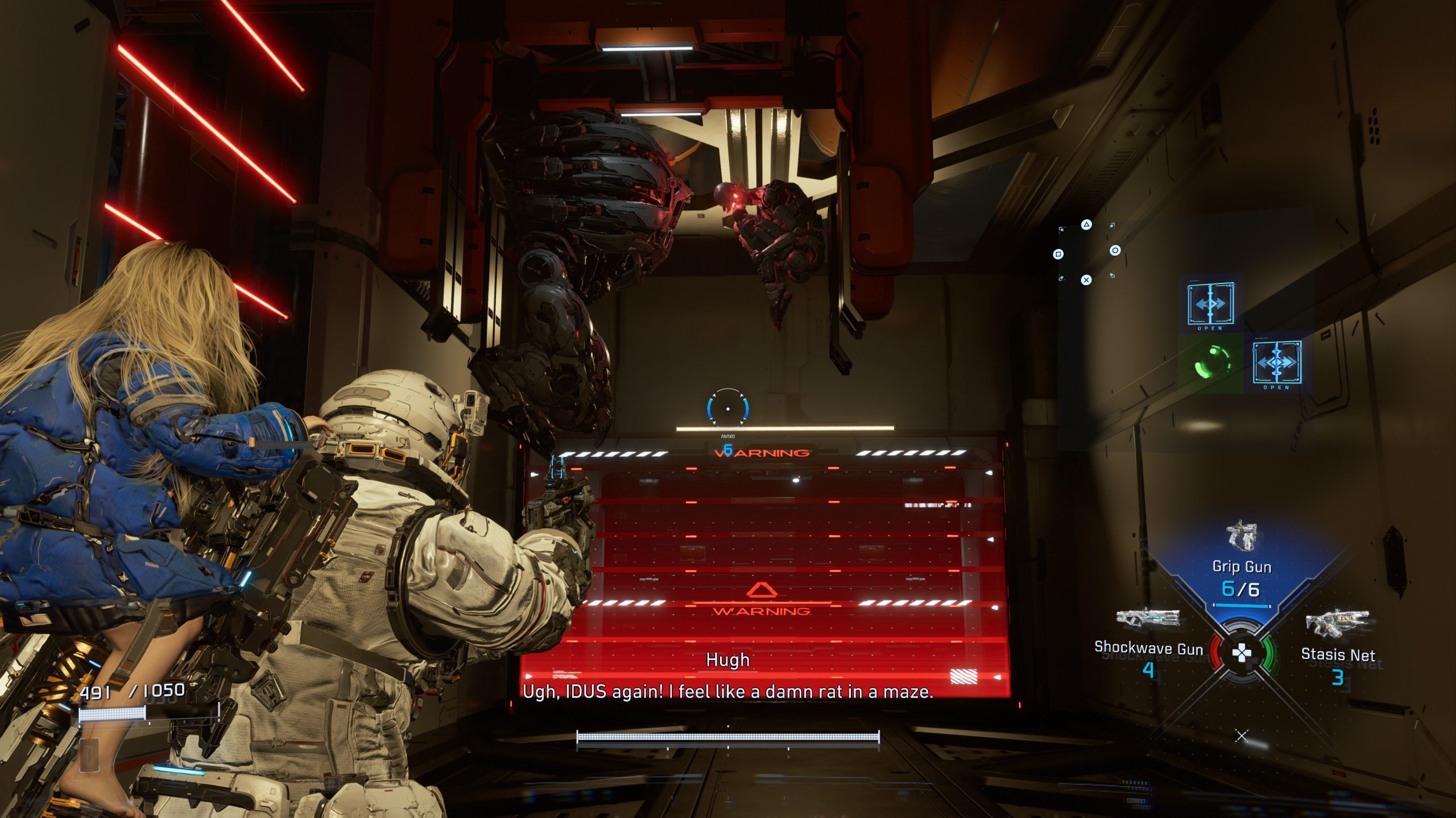 A character in the game PRAGMATA is aiming a weapon at a robotic enemy, with on-screen text reading 'WARNING', and a dialogue box saying, Ugh, IDUS again! I feel like a damn rat in a maze.