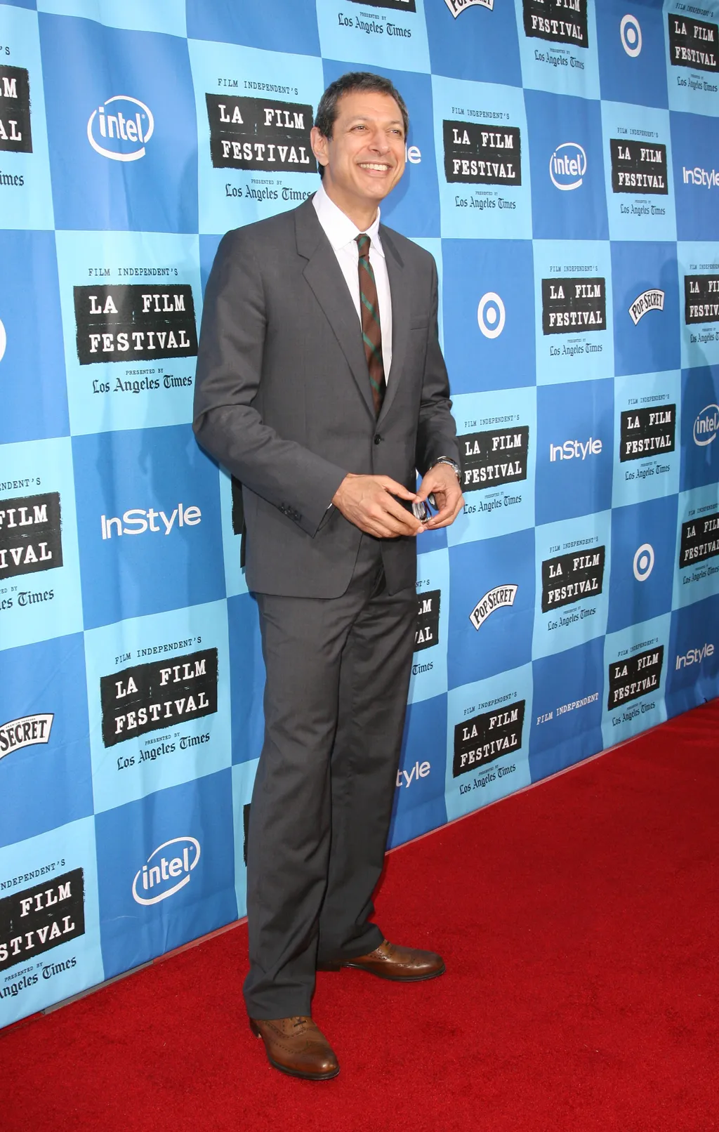 Image may contain Jeff Goldblum Fashion Adult Person Standing Clothing Formal Wear Suit Face Head and Accessories