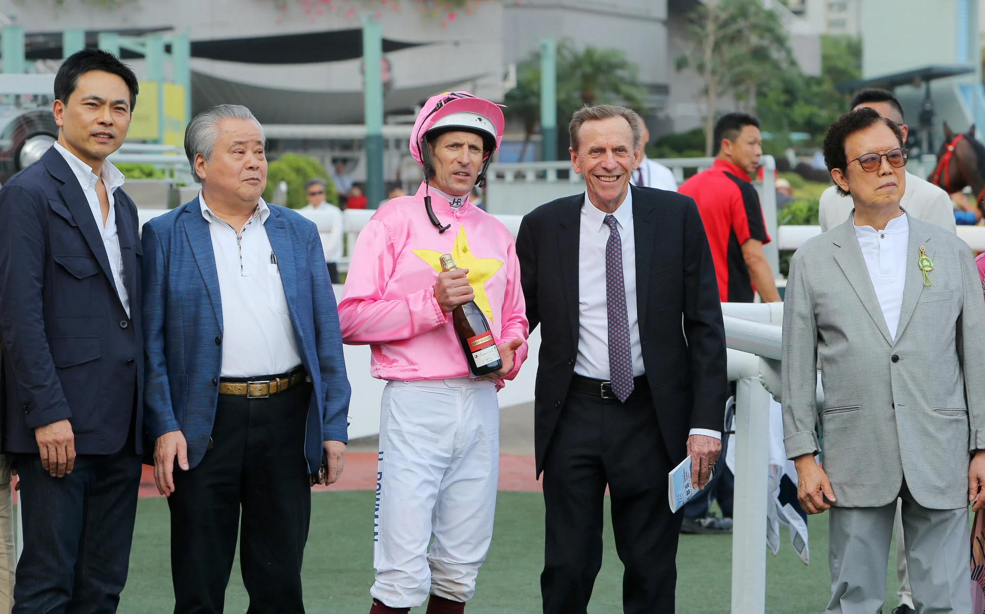 Jockey Hugh Bowman and trainer John Size (second from right) will combine again with Helios Express.