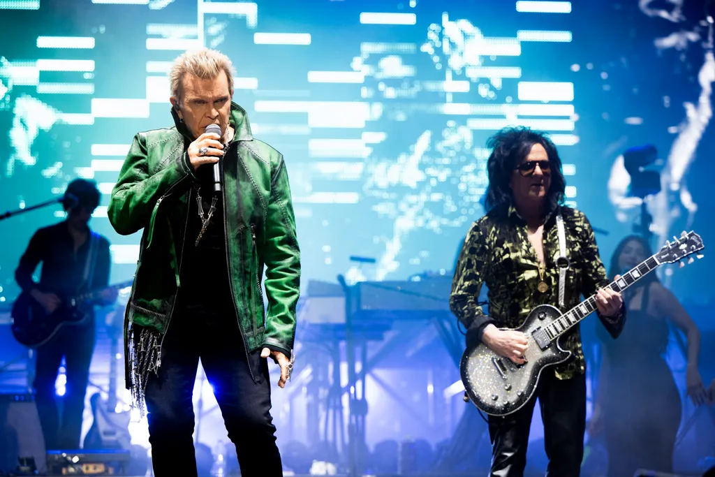 Image may contain Billy Idol Concert Crowd Person Adult Clothing Coat Jacket Guitar and Musical Instrument