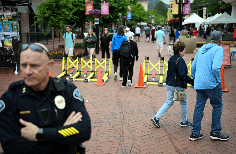 People walk past a police security barrier during the 30th annual Boulder Jewish Festival, a week after an attack that injured multiple people in Boulder, Colorado, US June 8, 2025.