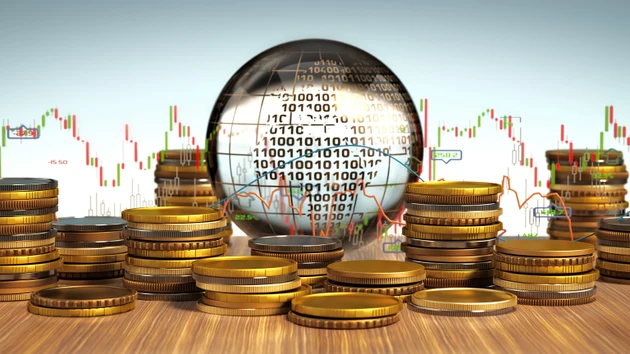 Global finance concept with coins and digital data displayed on a screen