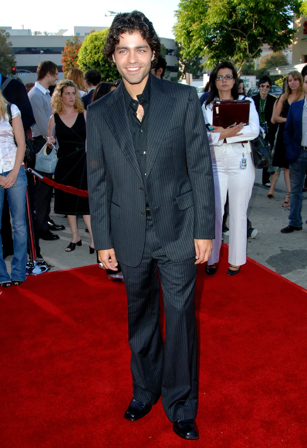 Image may contain Adrian Grenier Hala Gorani Fashion Adult Person Premiere Clothing Jeans Pants and Red Carpet