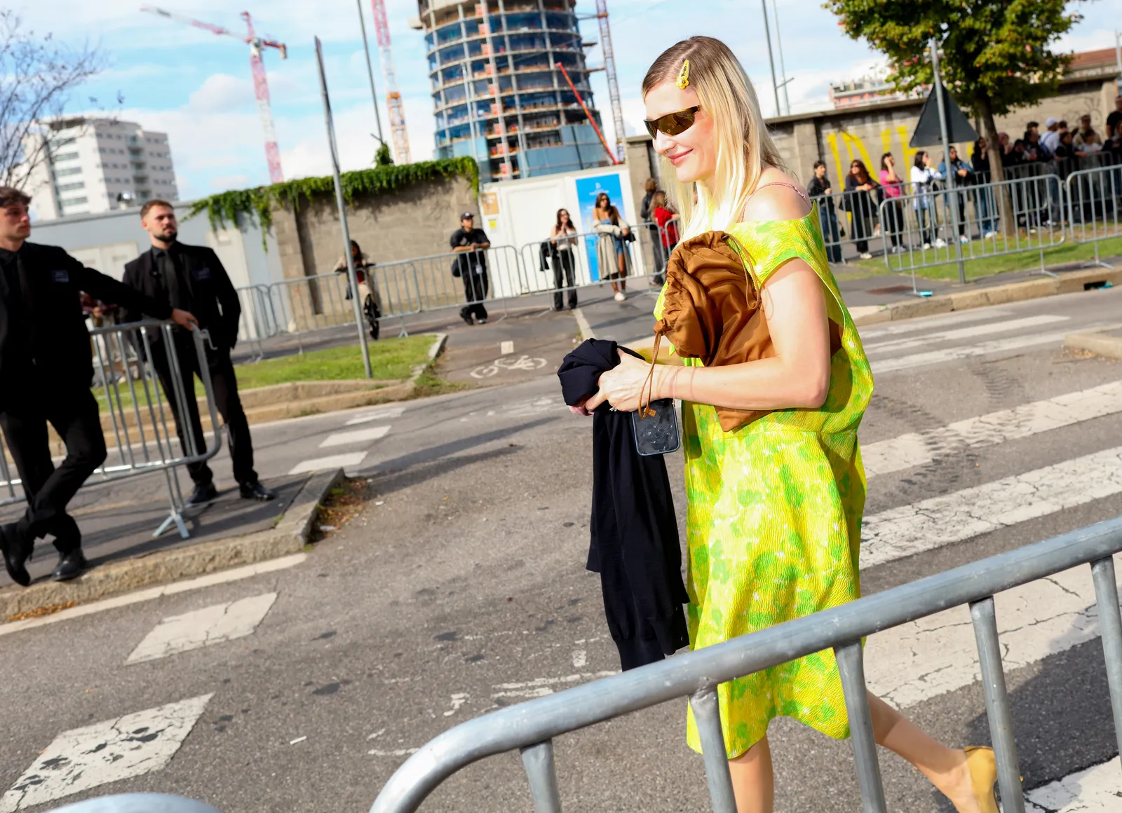 A street styler wears Prada. Milan fall 2026 readytowear
