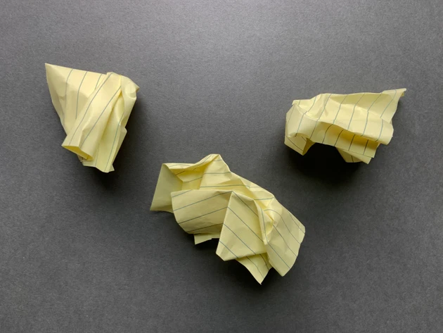 Crumpled Yellow Paper on Gray