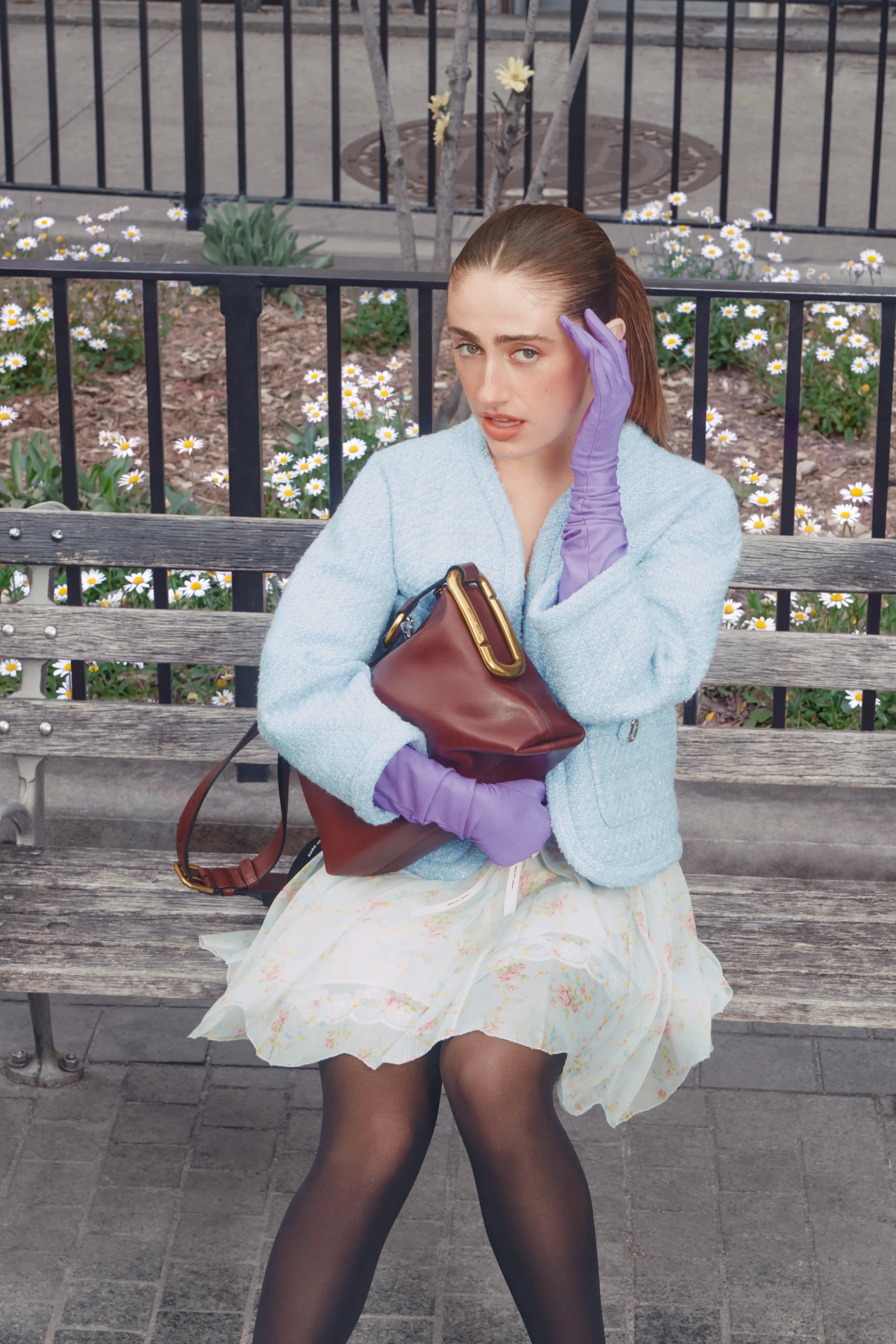 Image may contain Accessories Bag Handbag Purse Clothing Glove Face Head Person Photography Portrait and Adult