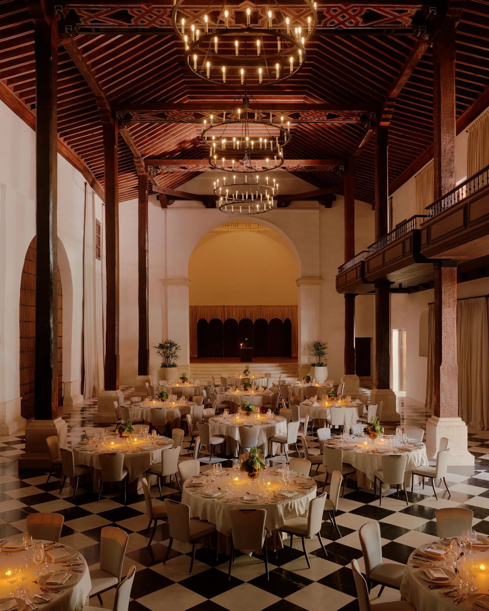 Image may contain Indoors Hall Fun Banquet Plant Chair Furniture Chandelier and Lamp