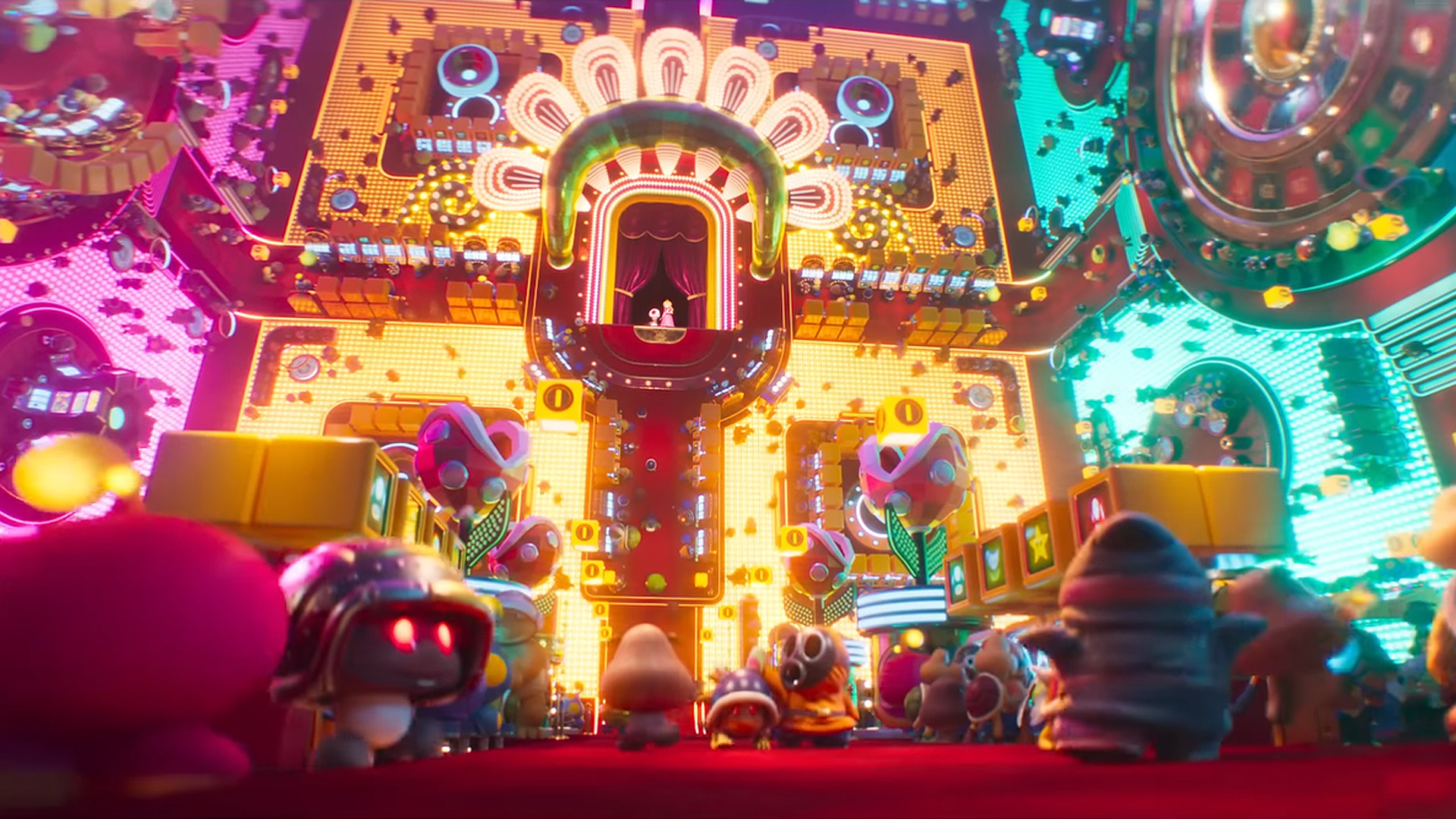 An animated scene from 'The Super Mario Bros. Movie' features colorful characters gathered in front of a large, brightly lit casino-themed building.
