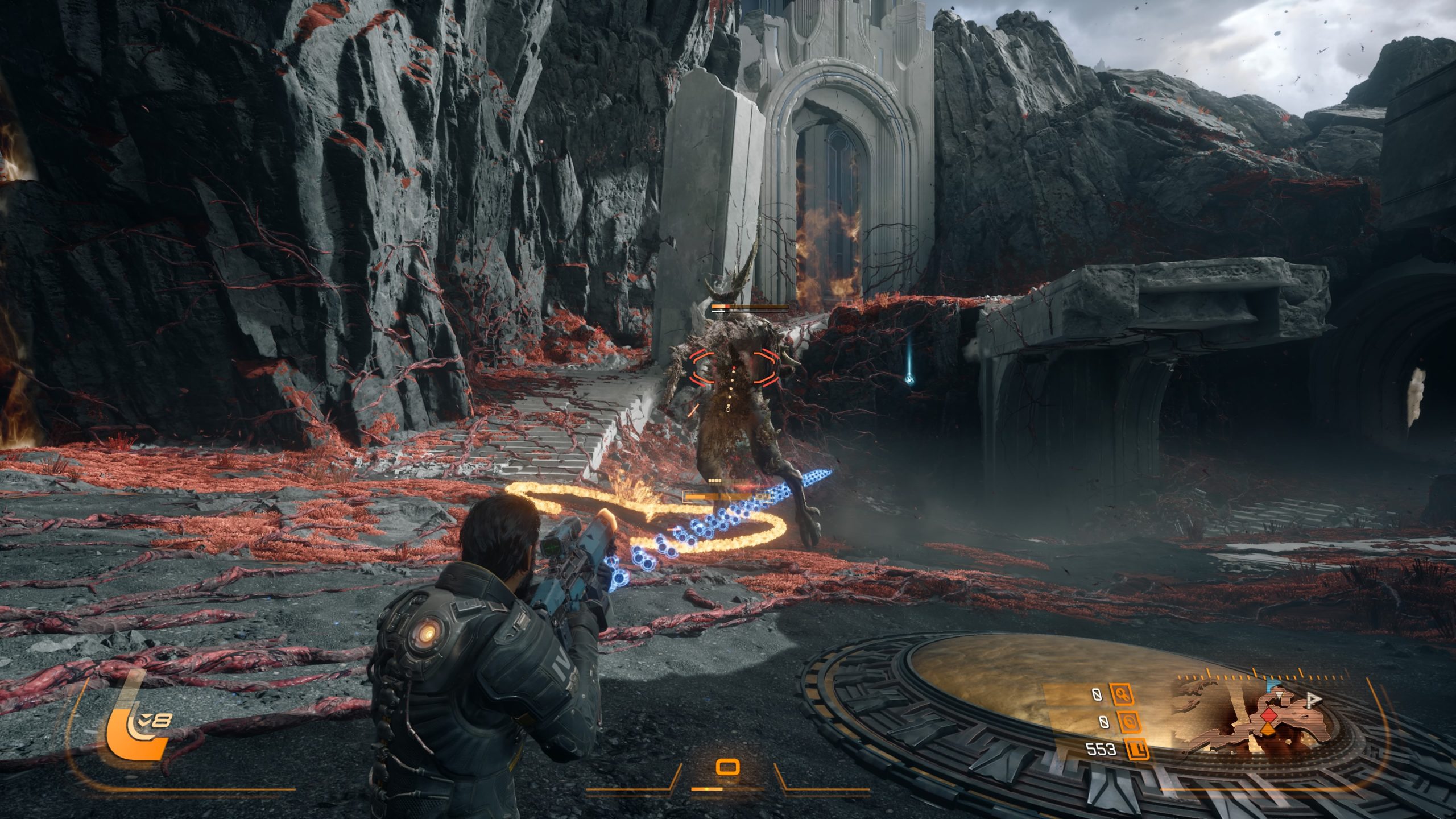 A player in Saros in a sci-fi suit aims a weapon at a horned enemy in a rocky, alien landscape, with a glowing path and UI elements visible on screen.