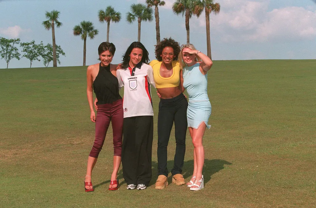 Image may contain Melanie C Melanie Brown Emma Bunton Victoria Beckham Grass Plant Face Head Person and Photography....