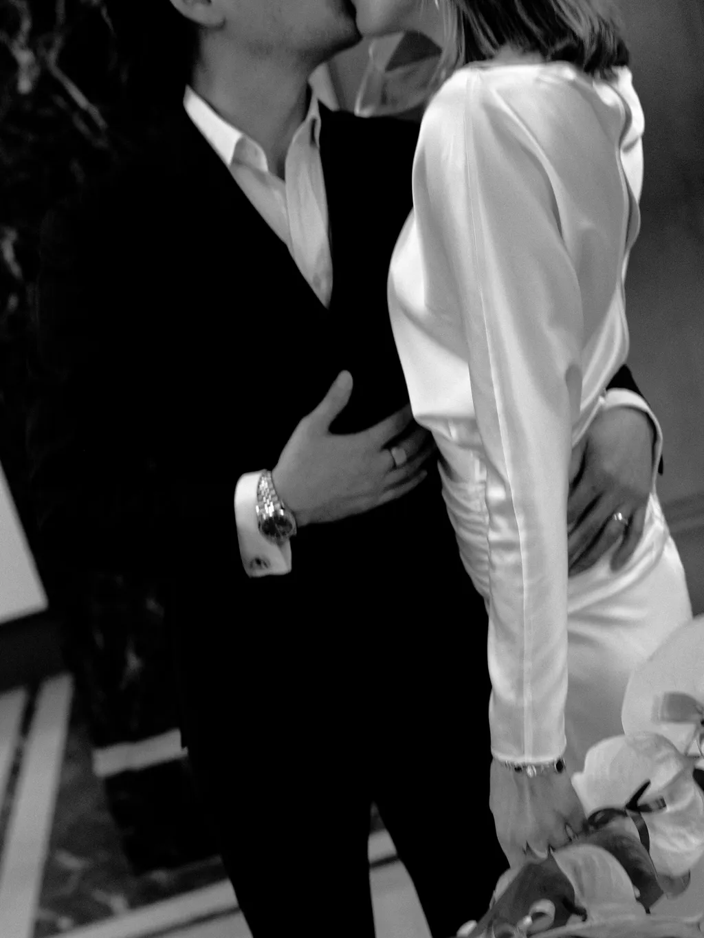 Image may contain Clothing Formal Wear Suit Tuxedo Shirt Dress Adult Person Coat Glove Face Head and Jacket