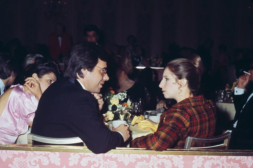 Image may contain Peter Bogdanovich Barbra Streisand Manna Chair Furniture Cup Accessories Glasses Adult and Person