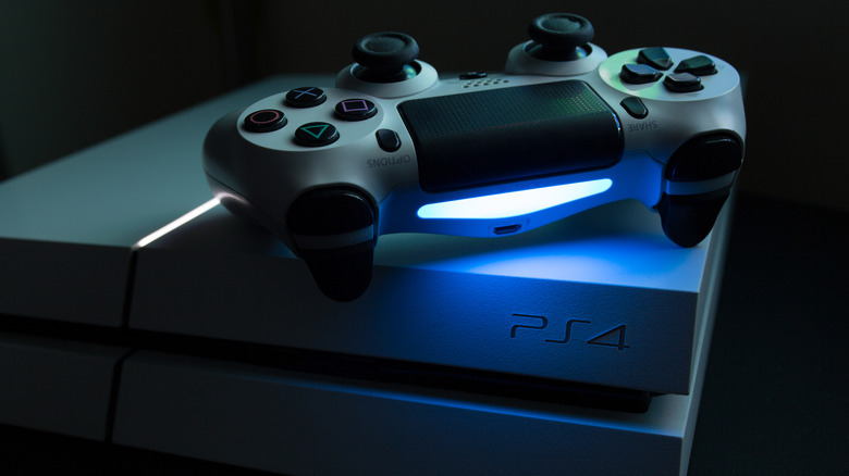 DualShock controller on PlayStation 4 with blue light bar.