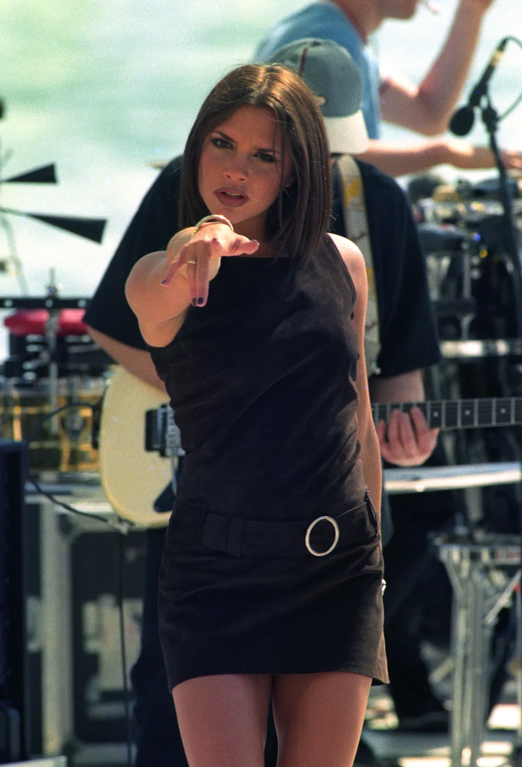 Image may contain Victoria Beckham Electrical Device Microphone Clothing Hat Adult Person Face Head and Photography....