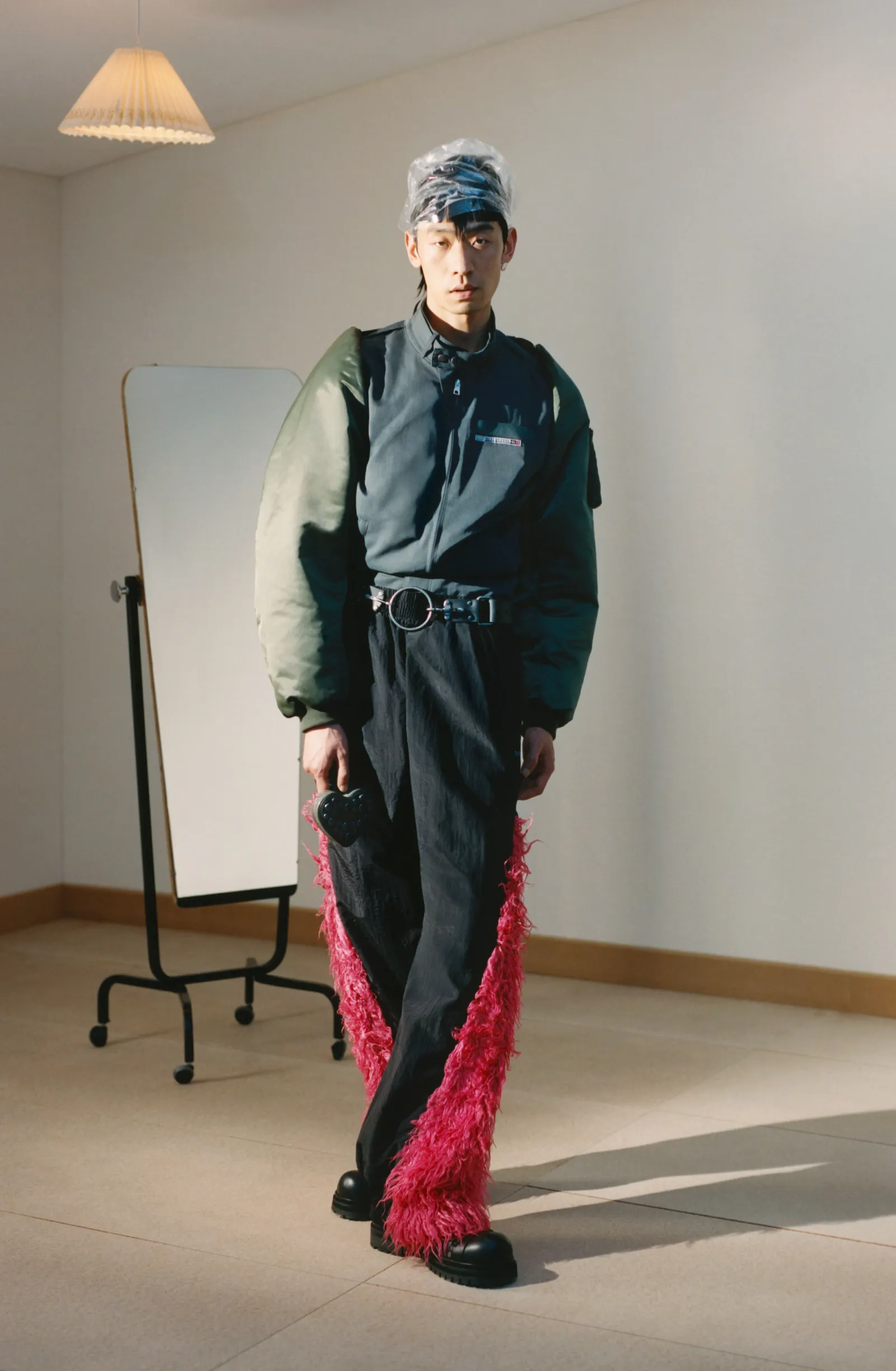 Image may contain Adult Person Clothing Pants White Board Accessories and Belt