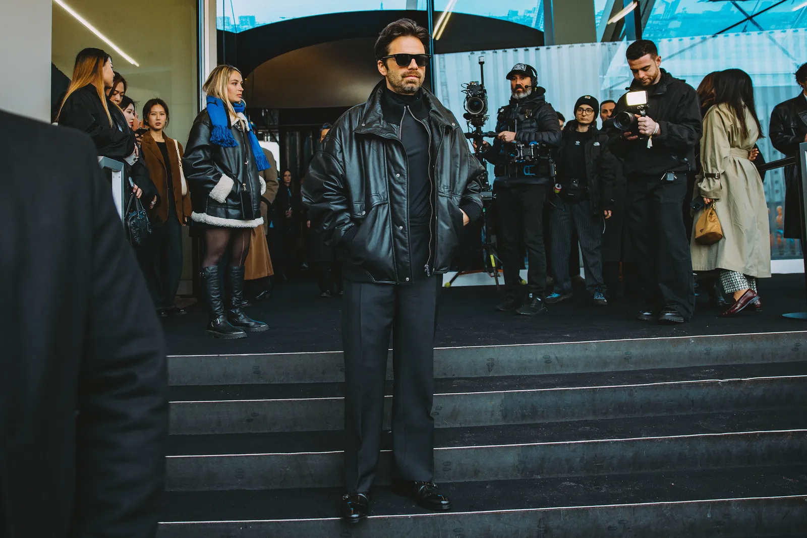 Image may contain Sebastian Stan Sergio Álvarez Conde Clothing Coat Jacket Adult Person Accessories Bag and Handbag