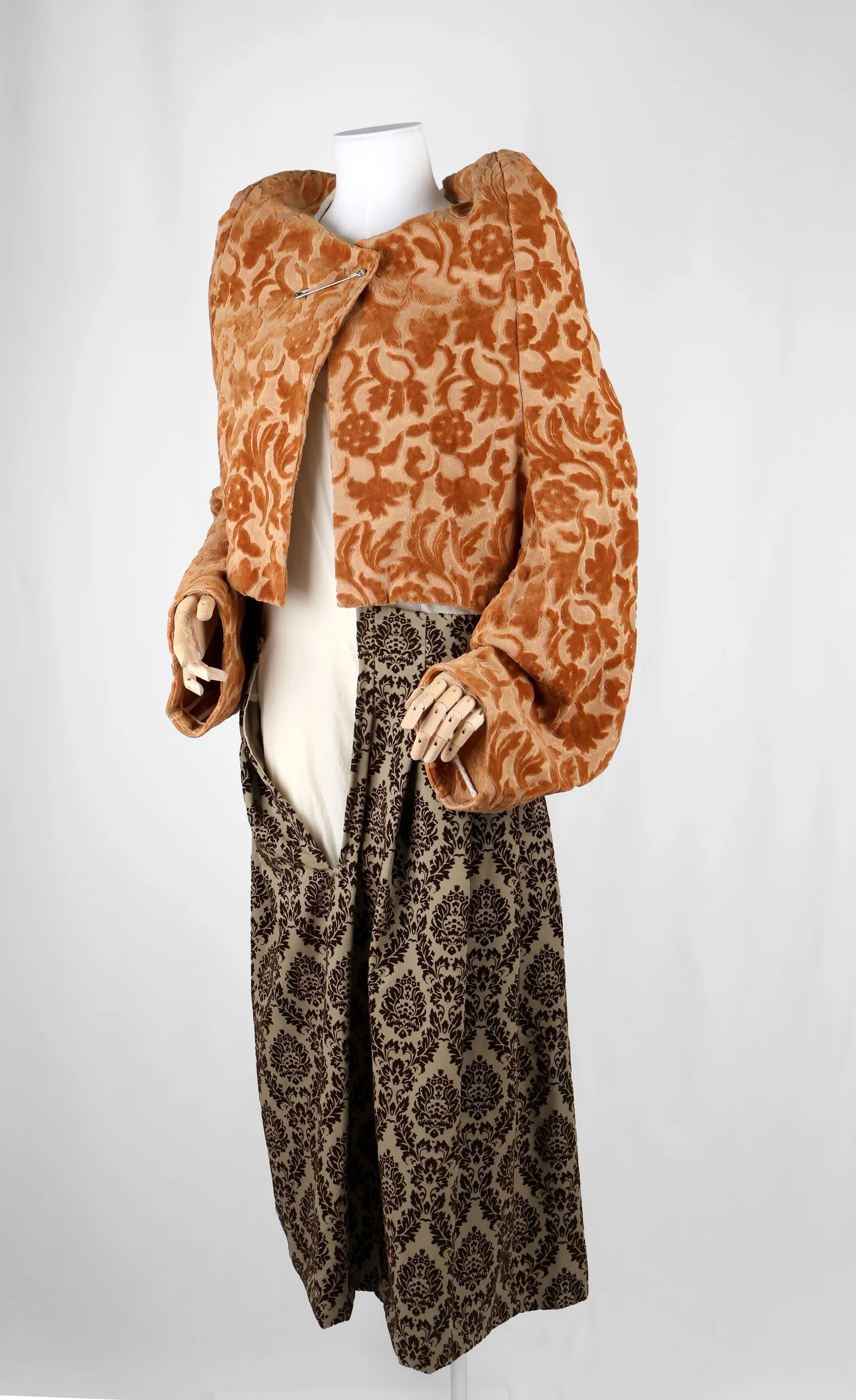 Image may contain Adult Person Clothing Coat Knitwear Sweater Velvet and Fur
