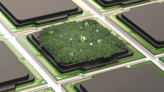 Concept design shows a computer chip with green grass and small flowers growing on it, blending technology with nature in a unique way