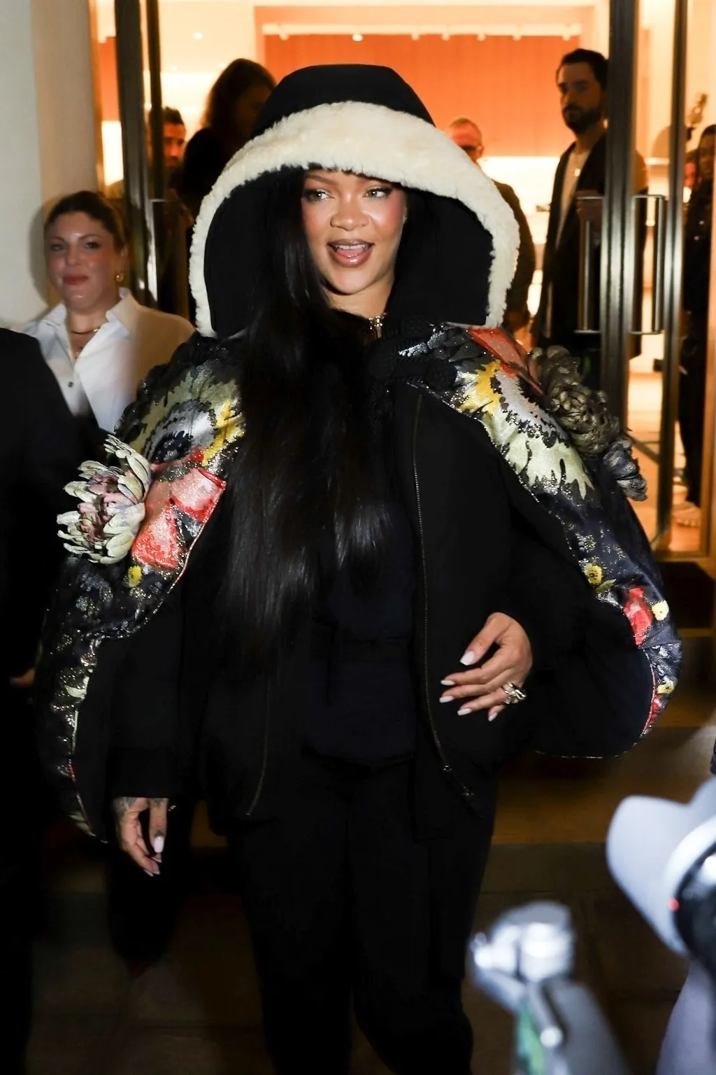 Rihanna is all smiles after a shopping session at Dior in Paris