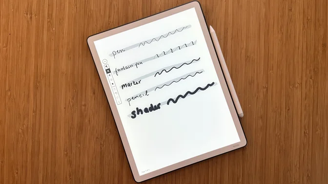 A Kindle Scribe (2025) on a wooden table.