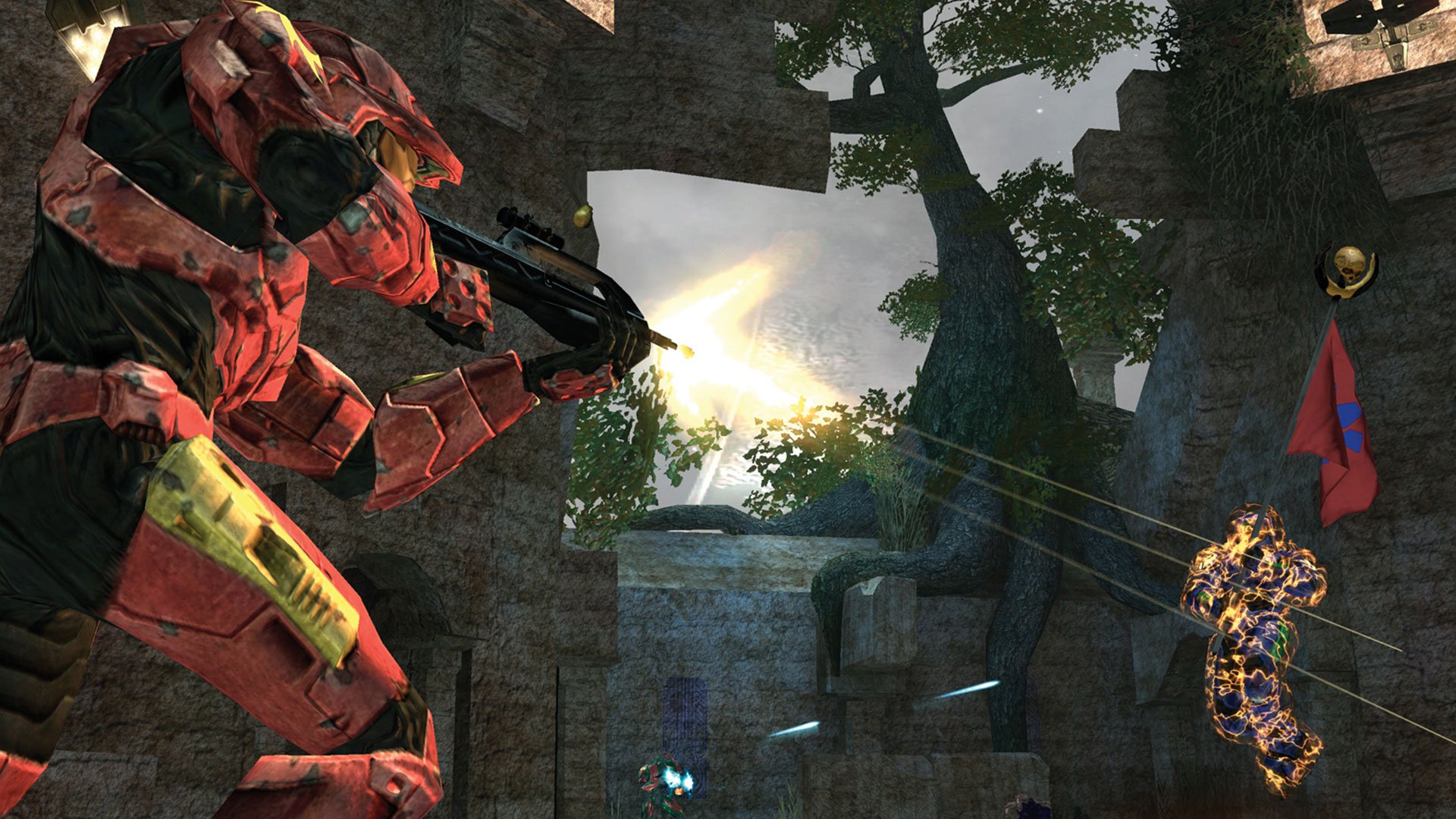 A red spartan from Halo aims a gun in a rocky, forested scene with sunlight streaming through. Nearby, a blue spartan is hit, and a red flag is displayed.