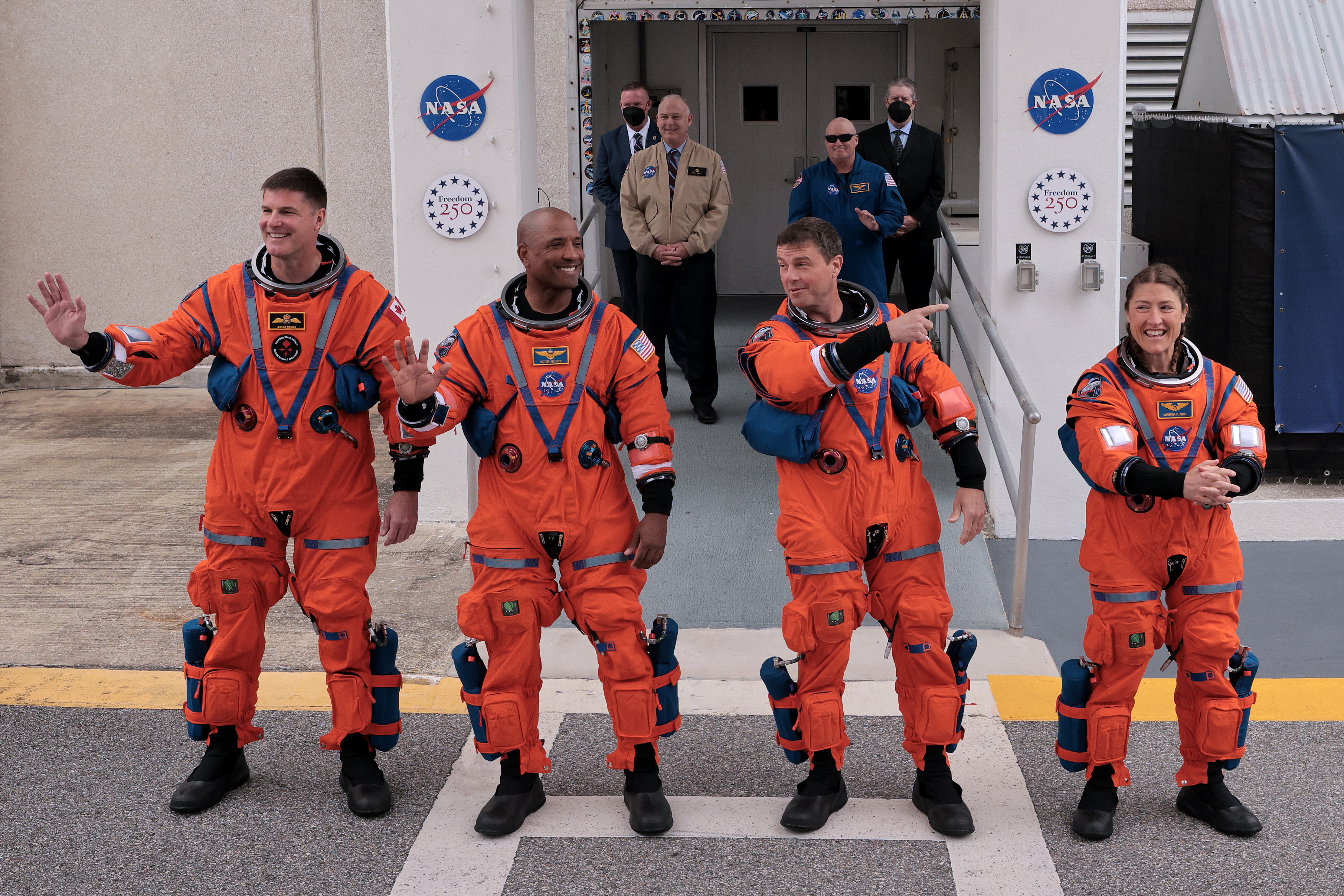 The Artemis II crew step out onto the tarmac prior to launch.