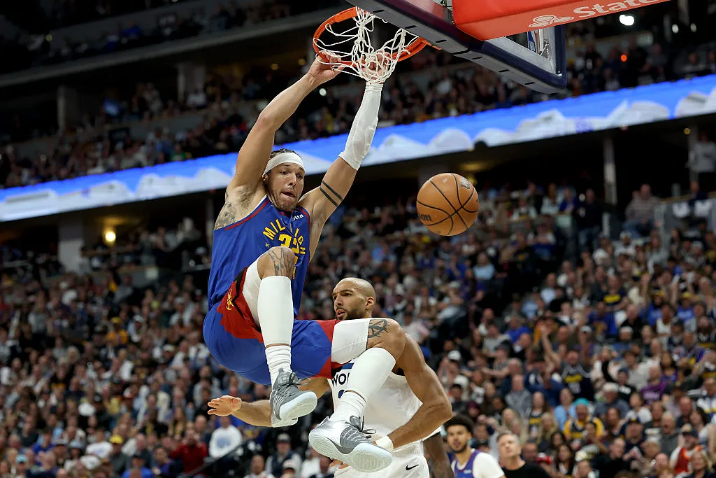 DENVER, COLORADO - APRIL 20: Aaron Gordon #32 of the Denver Nuggets dunks on Rudy Gobert #27 of the Minnesota Timberwolves in the first quarter during Game Two of the First Round of the NBA Western Conference Playoffs at Ball Arena on April 20, 2026 in Denver, Colorado. NOTE TO USER: User expressly acknowledges and agrees that, by downloading and or using this photograph, User is consenting to the terms and conditions of the Getty Images License Agreement. (Photo by Matthew Stockman/Getty Images)