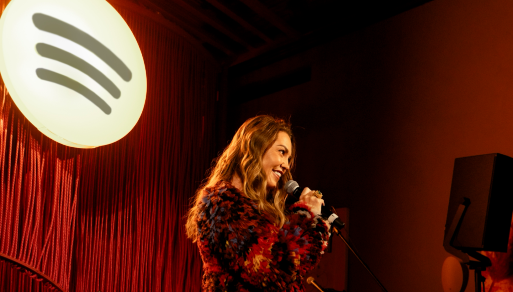 woman standing with microphone