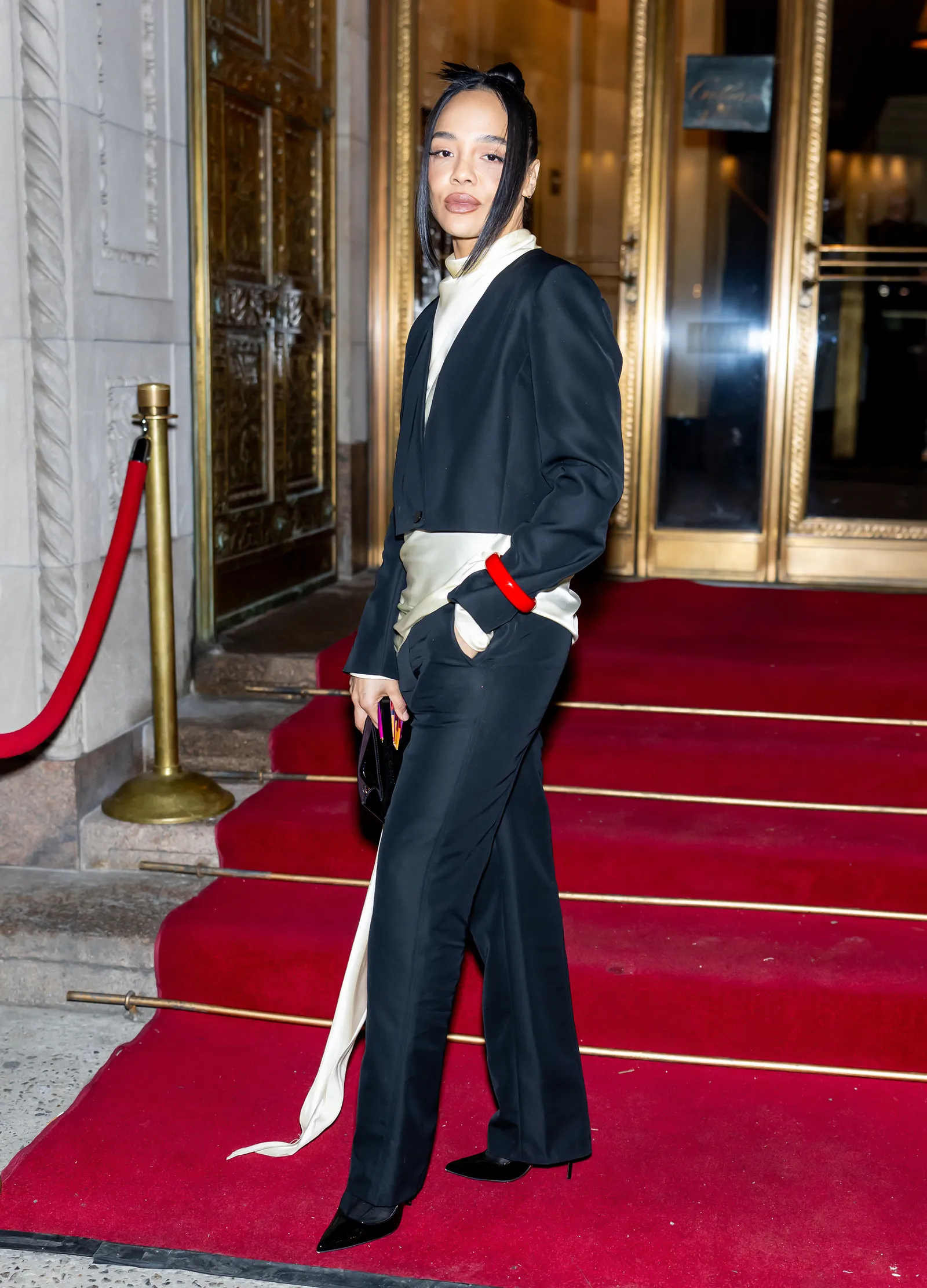 Image may contain Person Fashion Adult Clothing Coat and Standing