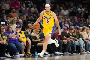 PHOENIX, ARIZONA - OCTOBER 14: Austin Reaves #15 of the Los Angeles Lakers controls the ball against the Phoenix Suns during the first half of the NBA game at Mortgage Matchup Center on October 14, 2025 in Phoenix, Arizona. NOTE TO USER: User expressly acknowledges and agrees that, by downloading and or using this photograph, User is consenting to the terms and conditions of the Getty Images License Agreement. (Photo by Kelsey Grant/Getty Images)