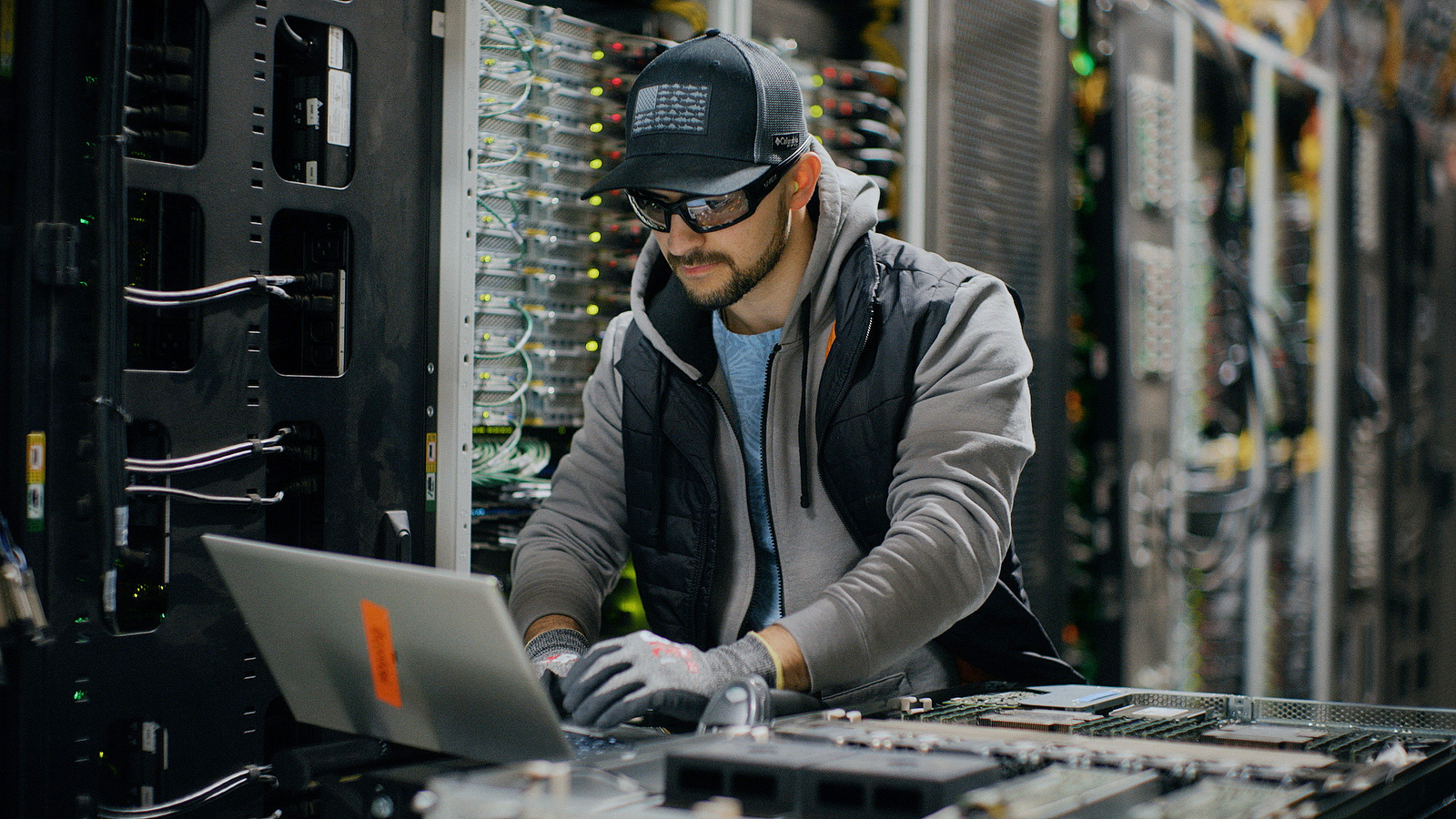inside a data center in eastern Oregon. Data center engineer troubleshooting with computer