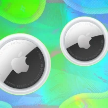 Apple AirTags on green background