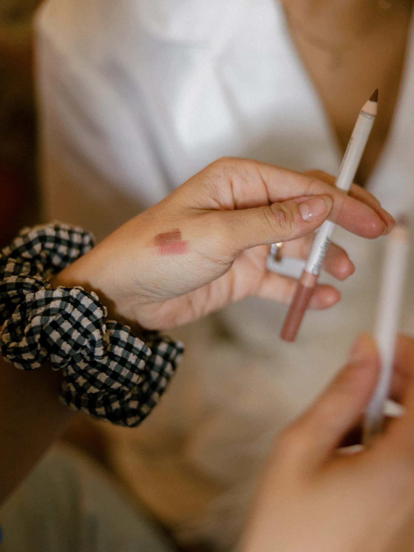 Image may contain Pen Baby Person Body Part Finger Hand and Cosmetics