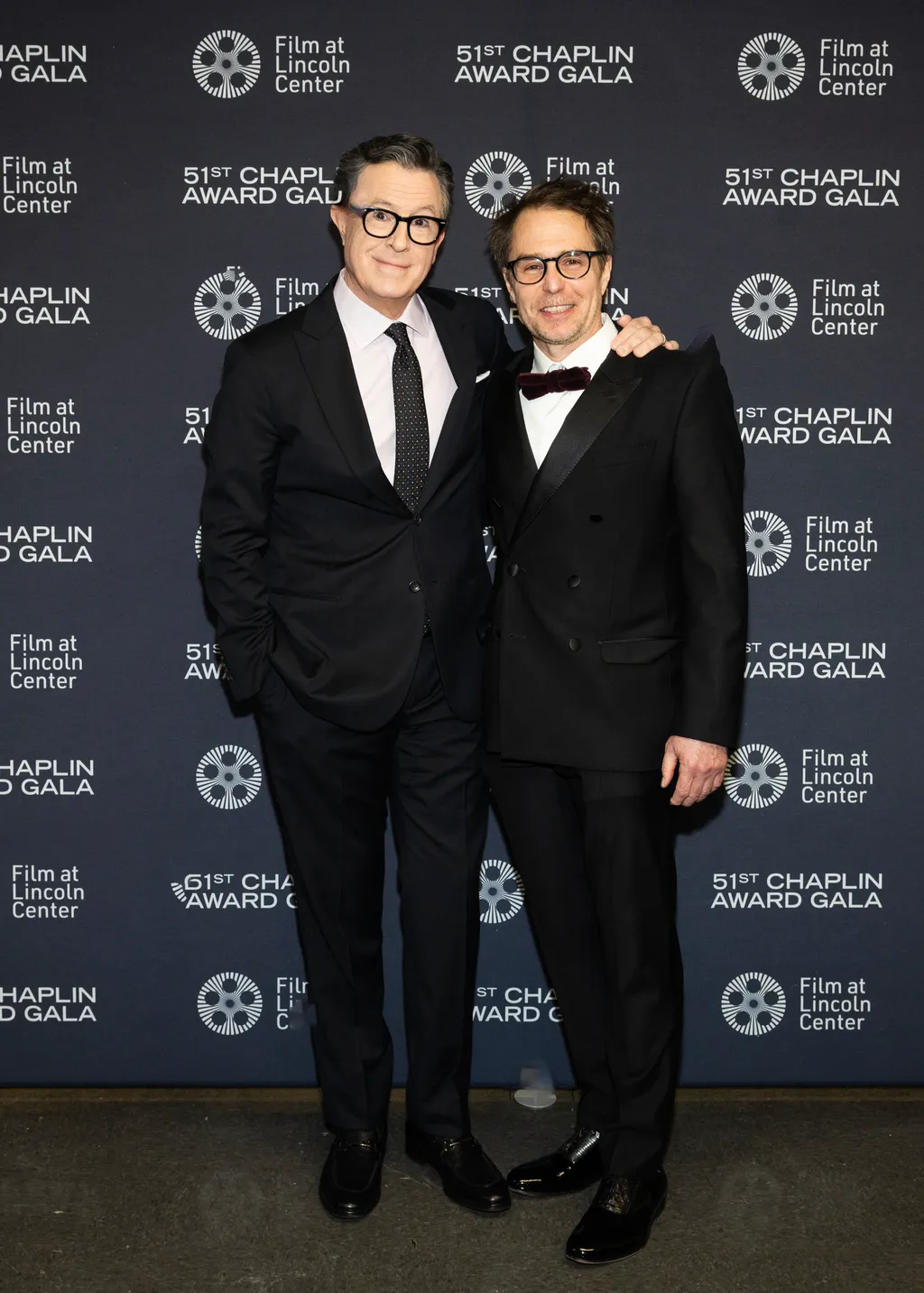 Image may contain Stephen Colbert Sam Rockwell Fashion Clothing Formal Wear Suit Coat Blazer Jacket and Adult
