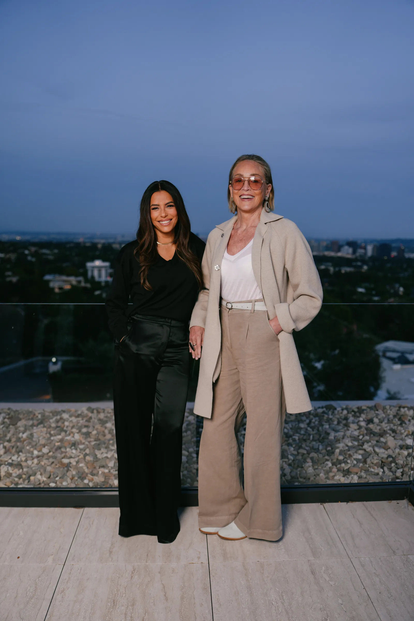 Image may contain Sharon Stone Eva Longoria Blazer Clothing Coat Jacket Pants Face Head Person and Photography